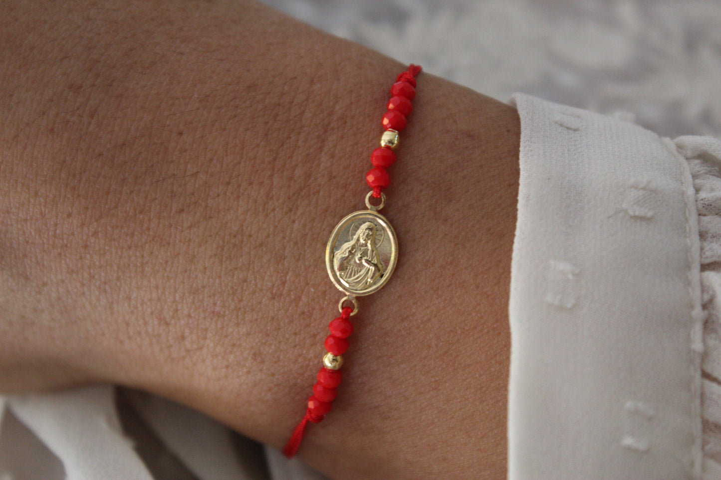 Pulsera Jesús Rojo C, fe que te acompaña cada día