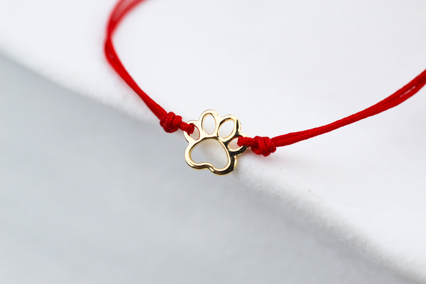 Pulsera Patita Cali Rojo, un símbolo para quienes aman a los animales