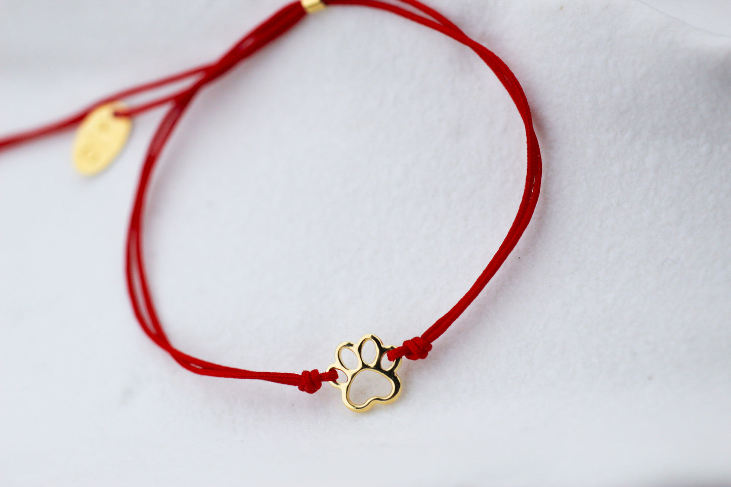 Pulsera Patita Cali Rojo, un símbolo para quienes aman a los animales