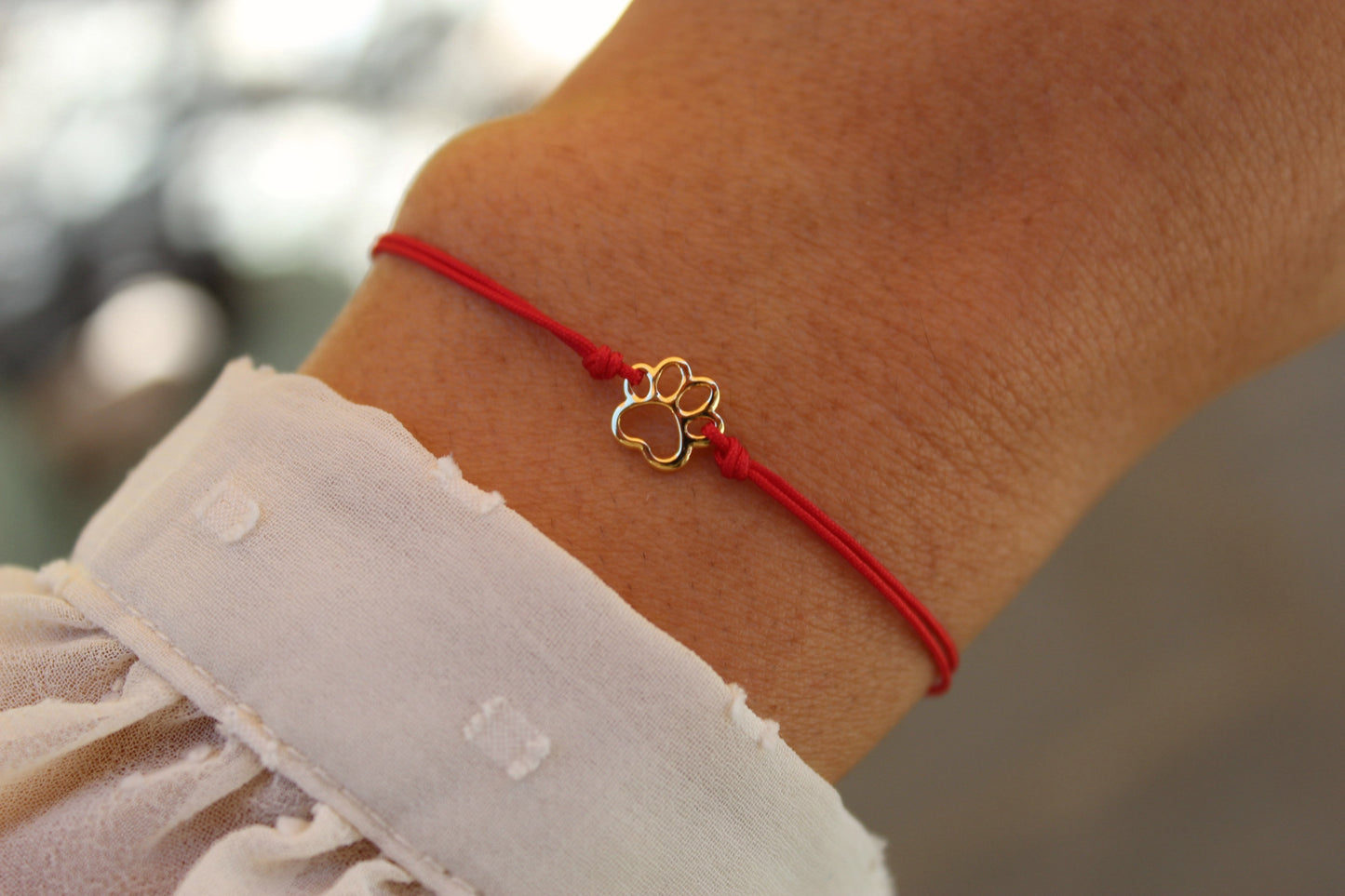 Pulsera Patita Cali Rojo, un símbolo para quienes aman a los animales