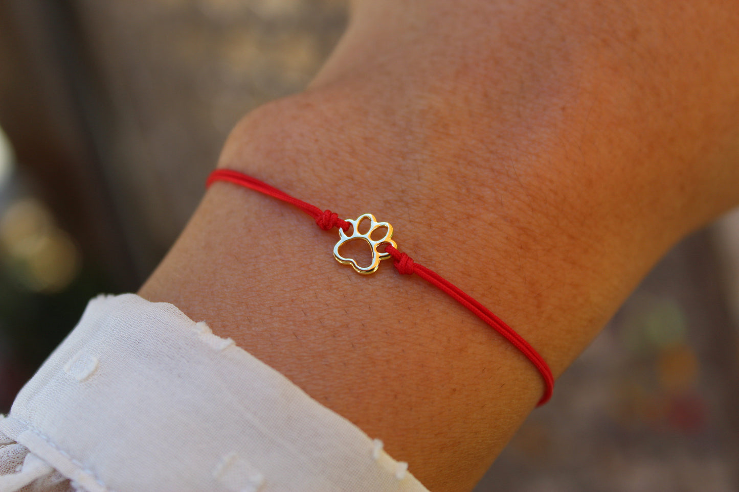 Pulsera Patita Cali Rojo, un símbolo para quienes aman a los animales